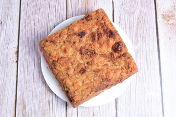 Fluffy bread cake with guava flavor on wooden background