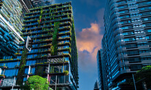 Apartment Block In Sydney NSW Australia With Hanging Gardens And Plants On Exterior Of The Building At Sunset With Lovely Colourful Clouds In The Sky
