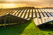 © Neil - UK Solar Park at sunset,vibrant golden sunlight reflecting from panels,Hampshire,England,United Kingdom.
