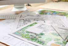 Landscape Designer's Projects On Table In Office