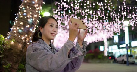 Sticker - Woman use mobile phone to take photo at night