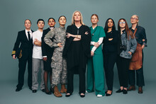 Empowered Female Workers Standing Together In A Studio