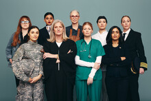 Portrait Of Different Female Workers Standing In A Studio