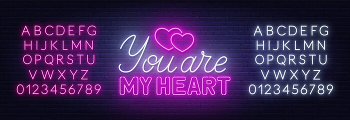 You are my heart neon lettering on brick wall background.