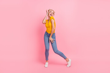 Sticker - Full body photo of cool young blond lady dance wear t-shirt jeans shoes isolated on pink color background