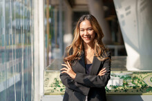 Beautiful Young Asian Business Woman Manager Smiling Looking At Camera With Crossed Arms.