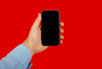 man's hand with shirt holding smartphone