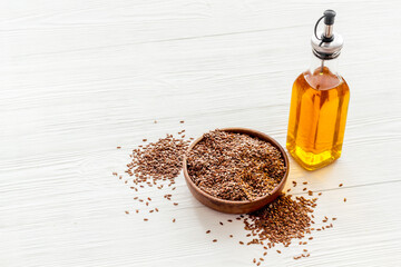 Wall Mural - Bottle of sesame cooking oil with seeds in bowl