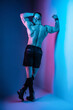 The pumped-out man in the studio in neon glow