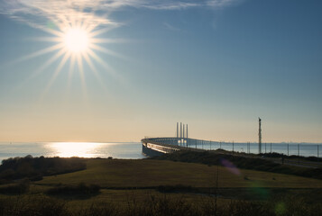 Wall Mural - The Oresund Bridge is a combined motorway and railway bridge between Sweden and Denmark (Malmo and Copenhagen). Lens flare.