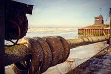 Closeup Of Tires On The Log Against The North Sea. Selected Focus.