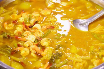 Wall Mural - Close-up of Sour soup with shrimp and vegetable, thai street food market