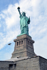 Wall Mural - Vertical shot of the Statue of Liberty in New York City, in the United States