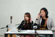 © Verin - video camera recording man and woman musician live streaming music online by social media in studio,selective focus at camera