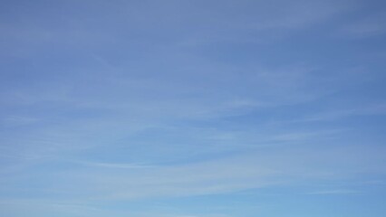 Wall Mural - beautiful sunny clear blue sky background. 4k video time lapse of sunny bright clean blue sky and so