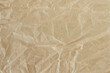 © Marinela - Crumpled paper texture background. A top table view, copy space. Blank baking paper sheet for footage or photo editing.