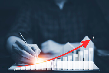 Wall Mural - Business losses on the stock market chart concept, Business use pen touch line market chart and Red arrows fall to the ground, indicating the economic recession that will occur in 2022