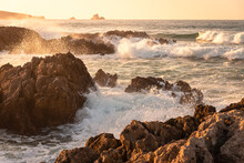 Rough Sea Waves Hit The Rocks At The Famous Surfing Beach Of Canallave At Sunset, Dunas De Liencres Natural Park And Costa Quebrada, Cantabria, Spain