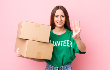 Poster - hispanic pretty woman smiling and looking friendly, showing number three. volunteer concept