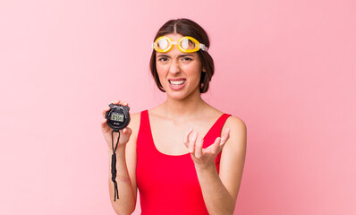 Poster - hispanic pretty woman looking angry, annoyed and frustrated. swimmer and timer concept