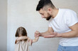© Julija - Father punishing his child, domestic violence concept.