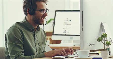 Aufkleber - I can work like this all day. 4k video footage of a cheerful young businessman working on his computer while listening to music through his headphones in the office.