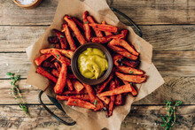 Sweet Potato Fries On A Metal Tray With Mustard Sauce On Wooden Rustic Background.