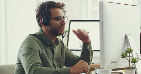 Aufkleber - Working to find you a solution. Handsome cheerful young caucasian male call center support agent working on his computer while wearing a headset listening to customers and trying to solve problems