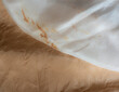 Close up of beige and white silk clothes - fine silk texture - fashion background
