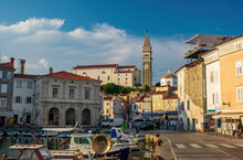 Harbour Of Piran, Slovenia. Historic Old Buildings And St. George's Parish Church With Italian Campanile On The Hill