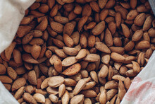 Fresh ripe almonds. Fresh raw almond nuts. Top view.
