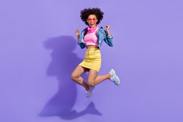 Full length body size view of attractive cheery lucky girl jumping holiday rest isolated on bright violet purple color background