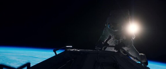 portrait of female astronaut performing spacewalk, working on a outer part of a space craft. space e
