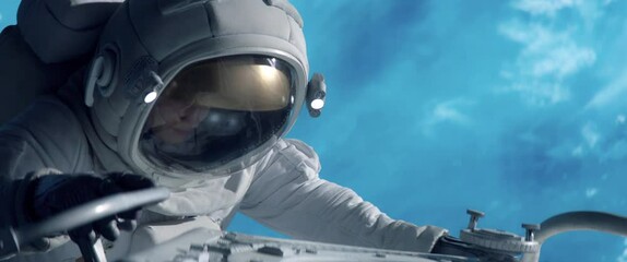 Wall Mural - portrait of female astronaut performing spacewalk, working on a outer part of a space craft. space e