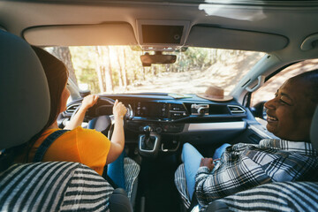 Wall Mural - Multiracial senior women having fun on the road in camper van - Travel concept - Focus on left female shoulder