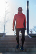 © 2Design - Front view of a senior caucasian athlete man training running up and down the stairs outdoors in a park in a sunny day