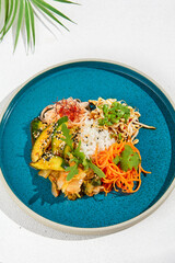 Canvas Print - Asian appetizers: spicy carrot, pickled cucumber, soy bean and rice. Assorted asian appetizers in ceramic dish on white background. Asian food in summer menu.