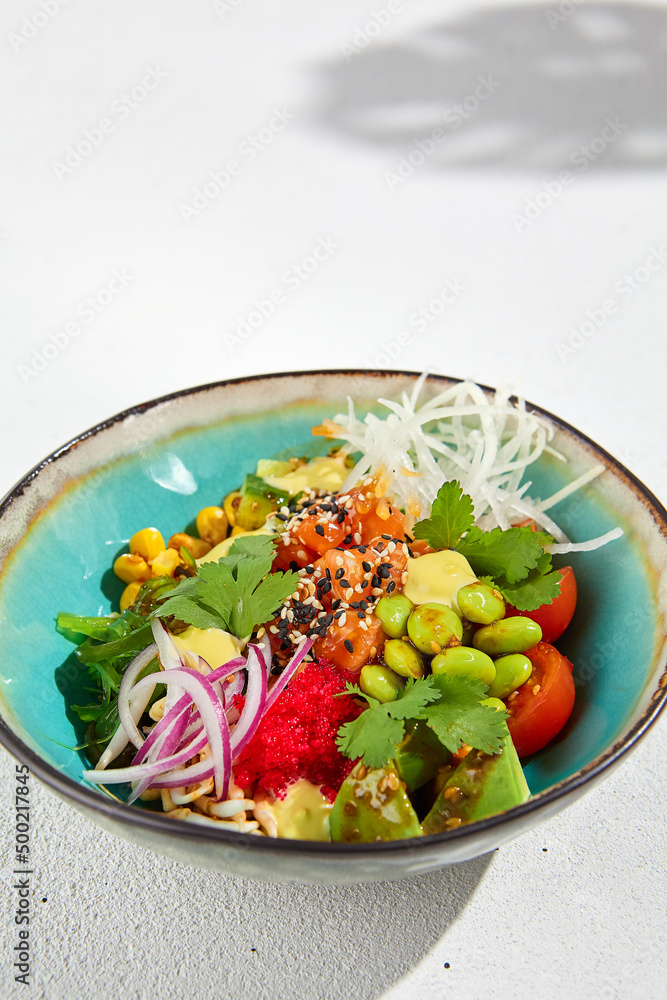 Hawaiian cuisine - Poke bowl with salmon, avocado, edamame and ...