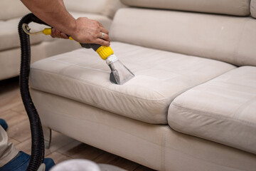 Cleaning a dirty sofa with a sofa washer