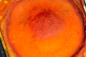 Wall Mural - Close-up macro shot of beautiful vibrant watercolour pallete with plenty of texture and details