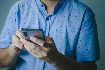 Wall Mural - social media technology concept Men are using smartphones for social media and online marketing including working from home. and searching for information in the world