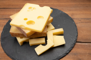 Swiss cheese collection, emmentaler with holes,  gruyere, appenzeller fondue cheeses