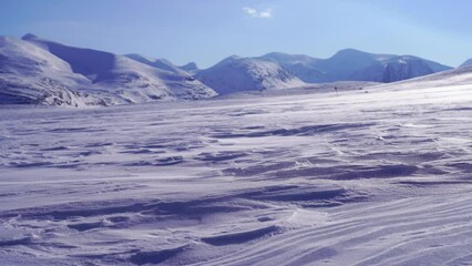 Fototapete - Spindrift over the snow covered mountains in Swedish Lapland.