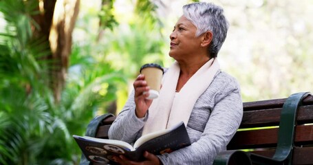 Poster - Getting a nice read in for the day. 4k video footage of a mature woman drinking coffee while reading a book in the park.