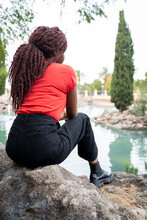 Unrecognizable Black Woman Near Pond