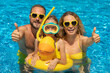 © Sunny studio - Happy family in outdoor pool