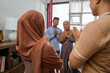 © Odua Images - beautiful muslim family visiting at the house on eid mubarak celebration