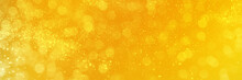 Bright Yellow Sparkling Glitter Bokeh Background, Banner Texture. Abstract Defocused Lights Header. Wide Screen Wallpaper. Panoramic Web Banner With Copy Space For Design