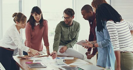 Aufkleber - As a team well make this work. 4k video footage of a group of young work colleagues having a meeting and discussing work related issues in the office together.