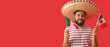 © Pixel-Shot - Handsome man in Sombrero and with Mexican flags on color background with space for text